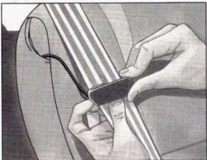 Close-up of hands tying a string around a string (no text or symbols visible)