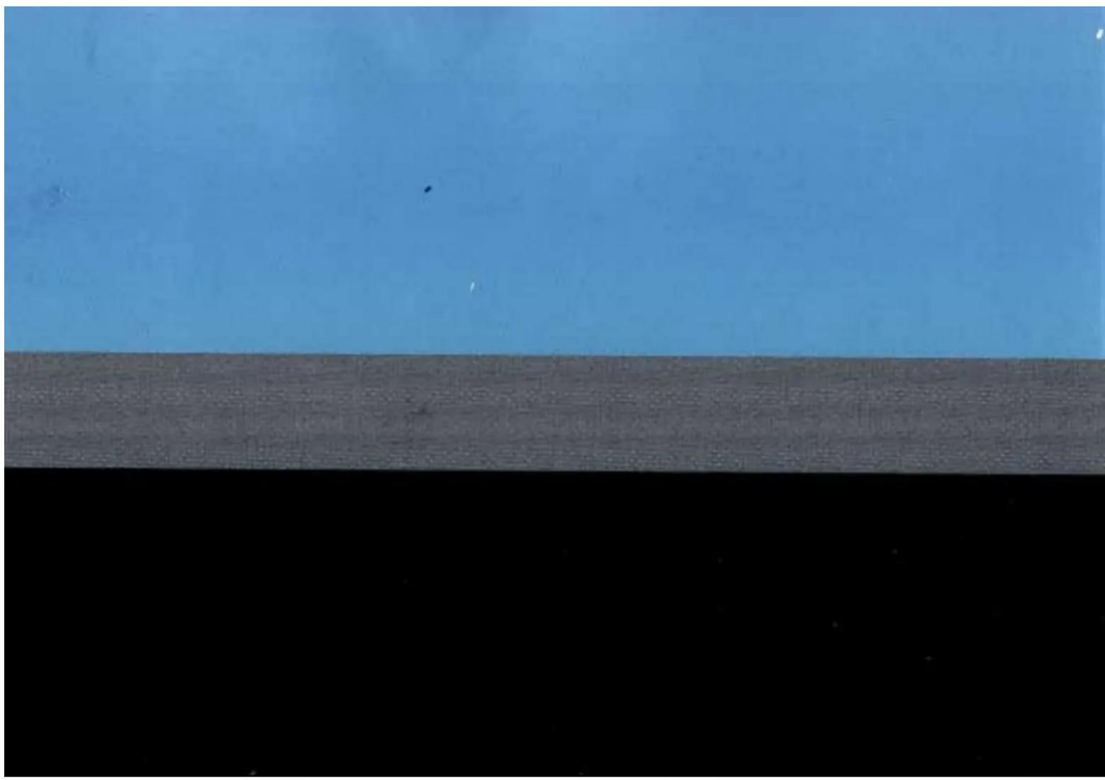 Abstract composition with a blue upper layer and a gray lower layer, no text or symbols present.