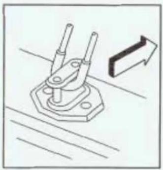 Technical line drawing of a mechanical clamp or bracket assembly with a directional arrow indicating motion (no text or symbols)