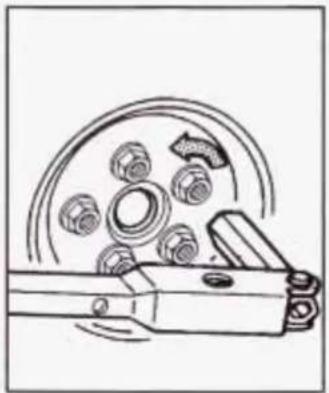 Technical line drawing of a mechanical component with bolts and a pulley (no text or symbols)