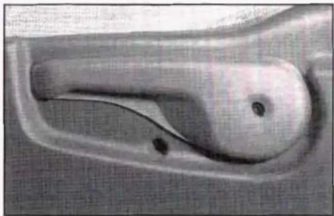 Close-up of a mechanical component with curved and straight sections, no visible text or symbols