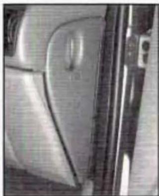 Close-up of a car's side panel showing the front wheel and side door (no visible text or symbols)