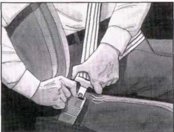 Close-up of hands adjusting a car seatbelt (no text or symbols visible)