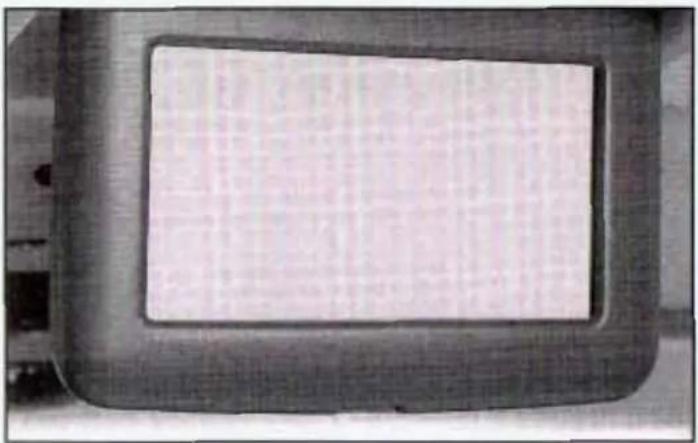 Close-up of a dark rectangular frame with a blank white panel, no visible text or symbols