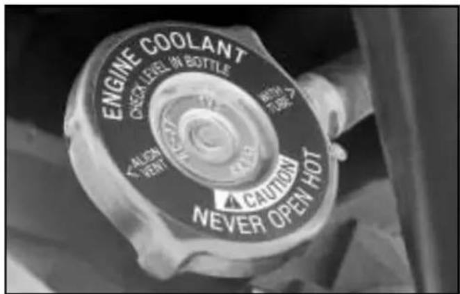 ENGINE COOLANT CHECK LEVEL OF BOTTLE TALIEN VENT CAUTION NEVER OPEN HOT