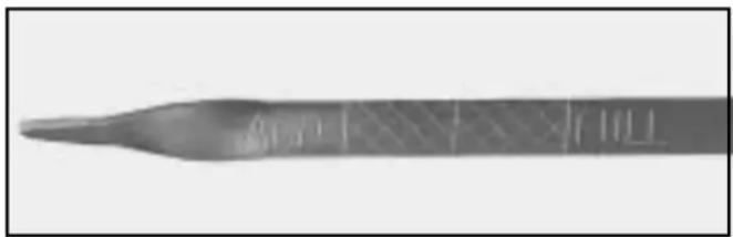 Close-up of a metallic tool tip with engraved markings (no readable text or symbols)