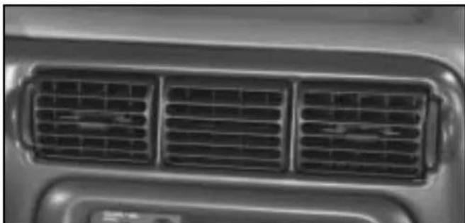 Close-up of a car's front grille with three grilles (no text or symbols visible)