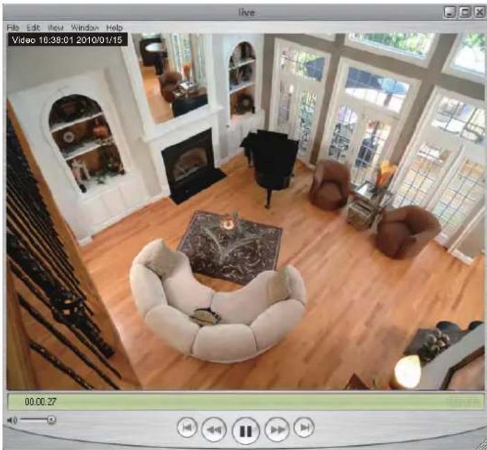 Interior view of a modern living room with wooden flooring, armchairs, and large windows (no visible text or symbols)