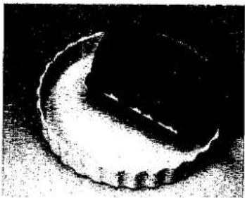 Black-and-white illustration of a crescent moon with a small human figure at the base (no text or symbols).