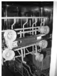 Industrial machinery setup with rollers and metal frame, no visible text or symbols.