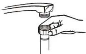 Line drawing of a hand holding a pipe fitting with a handle (no text or symbols)