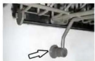 Mechanical assembly with a curved linkage and a directional arrow (no text or symbols visible)