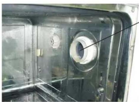 Close-up of a mechanical component with a circular opening and internal features (no visible text or symbols)