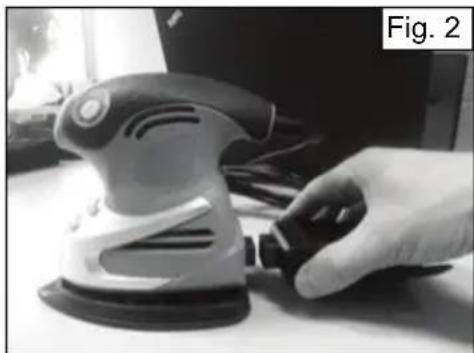 Hand using a power tool on a workbench, labeled 'Fig. 2' in the corner (no other text or symbols visible)