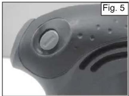 Close-up of a mechanical component with a circular knob and textured surface (no visible text or symbols)