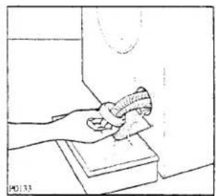 Line drawing of a hand cleaning a wall with a cloth (no text or symbols)