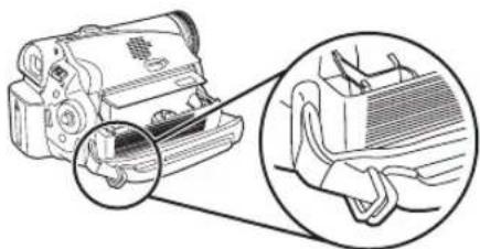 Illustration of a handheld device with a magnified inset showing its internal structure (no text or symbols)