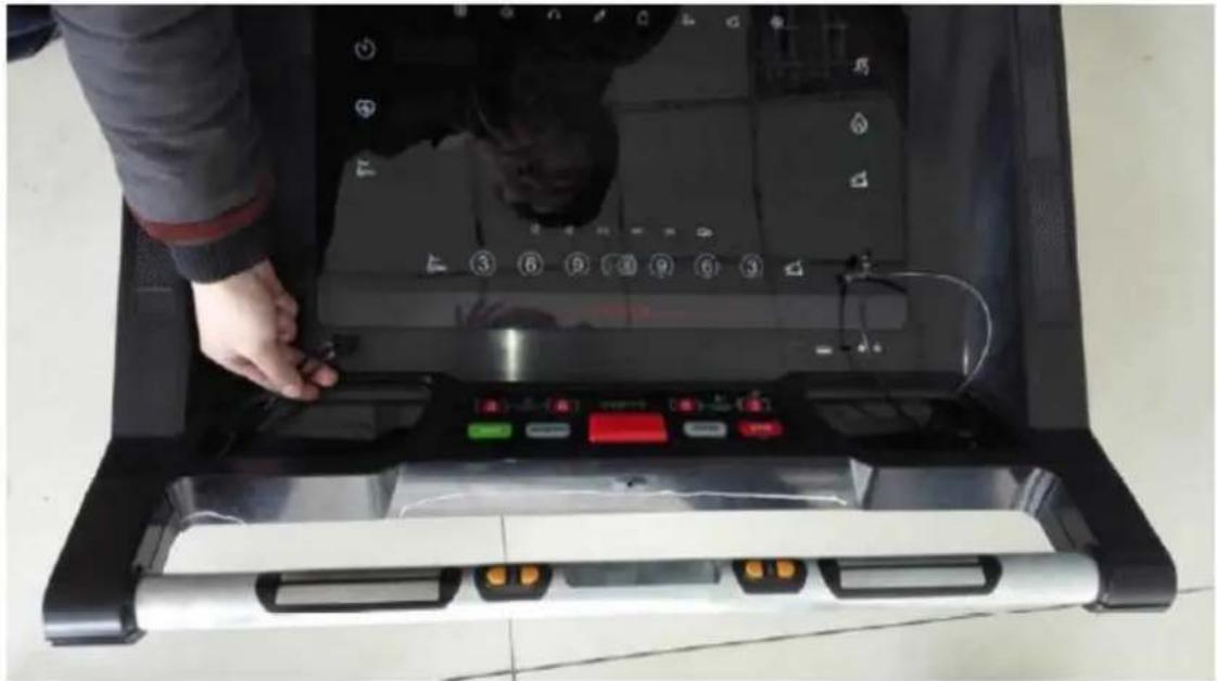 Person operating a laptop with control panel and keyboard (no visible text or symbols)