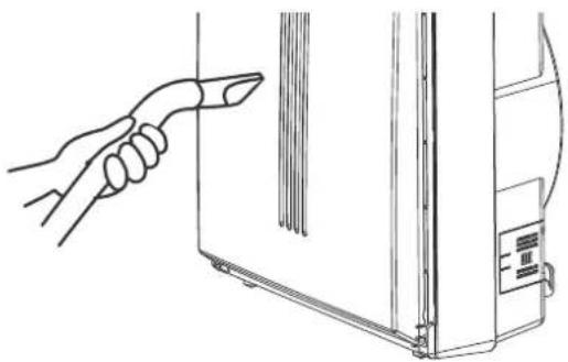 Line drawing of a hand pointing at a panel or component, next to a device with a control panel (no text or symbols)