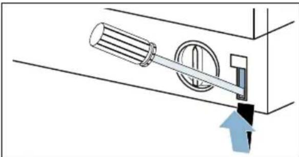 Diagram of a mechanical device with a cylindrical component and circular housing, showing an upward arrow (no text or symbols)