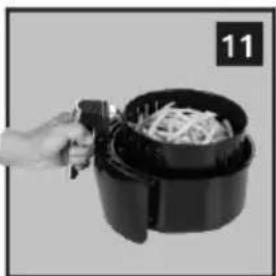 Hand holding a black air fryer with food being processed (no visible text or symbols)