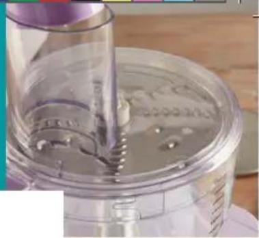 Close-up of a kitchen mixer with a pipette inserted into a clear container (no visible text or symbols)