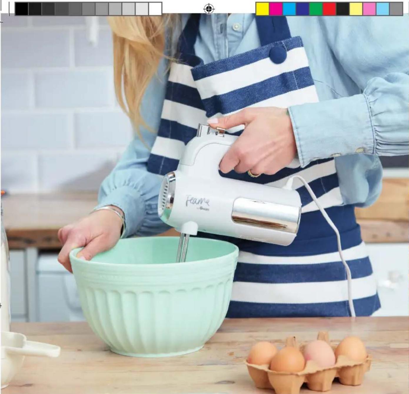 Person using a Feume brand blender to mix eggs in a kitchen setting (no text or symbols visible)