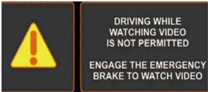 DRIVING WHILE WATCHING VIDEO IS NOT PERMITTED ENGAGE THE EMERGENCY BRAKE TO WATCH VIDEO