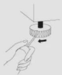 Hand holding a tool with a circular component and arrow indicating rotation (no text or symbols)