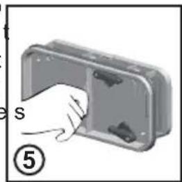 Illustration of a hand inserting a component into a device housing (no text or symbols).