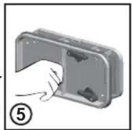 Hand inserting a component into a metal housing (no text or symbols visible).