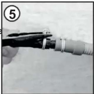 Close-up of a hand holding a cable with a wire, no visible text or symbols