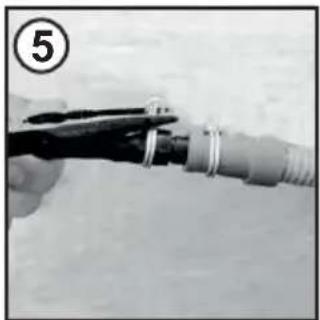 Close-up of a hand holding a tool with a coiled cable, no visible text or symbols.