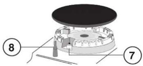 Technical diagram of a mechanical assembly with numbered components, likely a device or component layout.