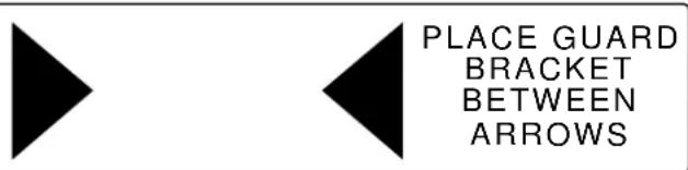 PLACE GUARD BRACKET BETWEEN ARROWS