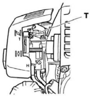 Technical diagram of a mechanical assembly with labeled parts T and H, showing internal components and connections.