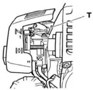 Technical diagram of a mechanical assembly with labeled parts T and H