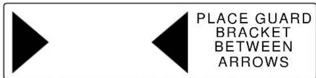 PLACE GUARD BRACKET BETWEEN ARROWS