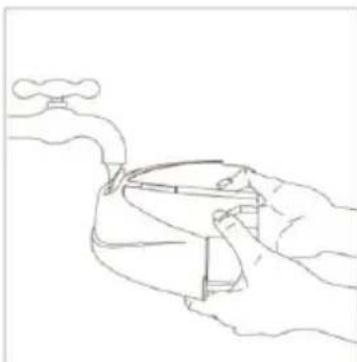Line drawing of a hand holding a device with a faucet above, no text or symbols present.