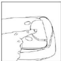 Line drawing of a mechanical component with a finger inserted (no text or symbols)