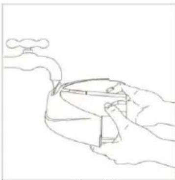 Line drawing of hands holding a device with a faucet above (no text or symbols).