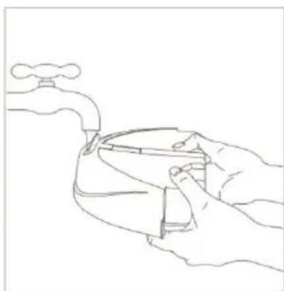 Line drawing of hands holding a small object with a faucet above (no text or symbols)