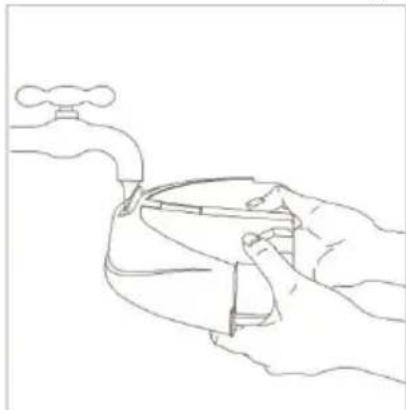 Line drawing of a hand holding a faucet with a handle, no text or symbols present