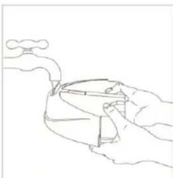 Line drawing of a hand holding a water tap with steam rising (no text or symbols)
