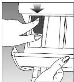 Illustration of hands inserting a component into a device (no text or symbols visible).
