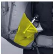Close-up of a yellow safety bag attached to a dark vehicle seatbelt (no visible text or symbols)
