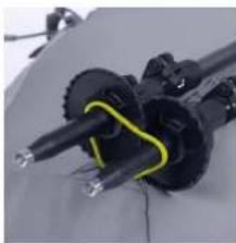 Close-up of mechanical components with black and yellow connectors (no visible text or symbols)