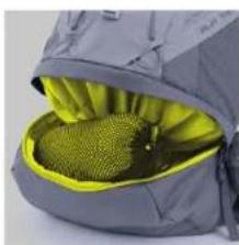 Close-up of a gray backpack with a yellow mesh cushion inside, no visible text or symbols