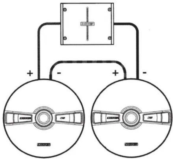 Diagram showing two circular components with labeled terminals and a central rectangular box, possibly representing a device or system layout.