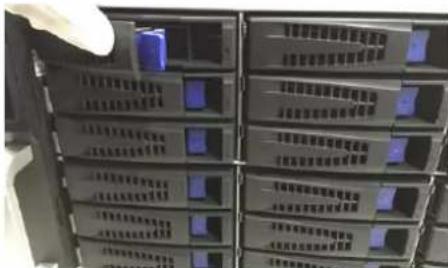 Stacked electronic device racks with Chinese labels showing power, ground, and control modules